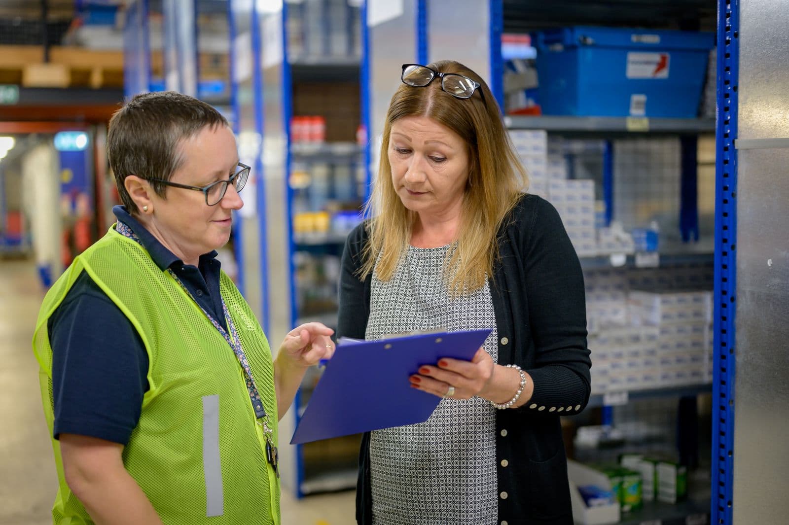 Two people reviewing a checklist together during a site walk