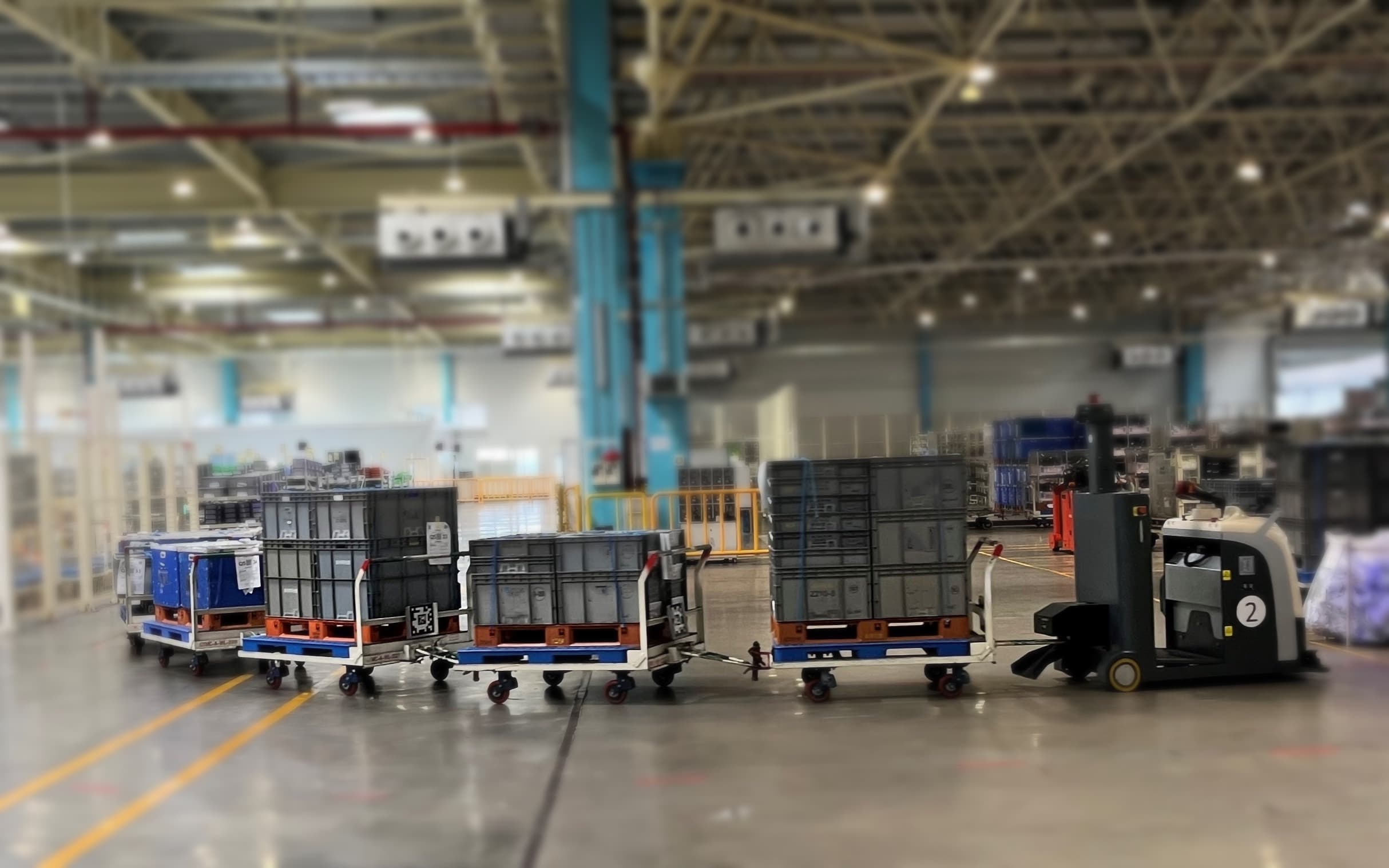 Autonomous material transport crossing a plant floor