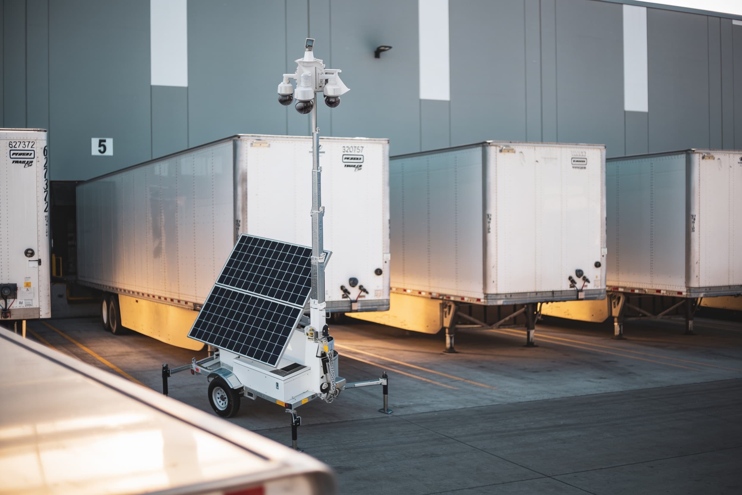 Solar security trailer covering an outdoor storage yard