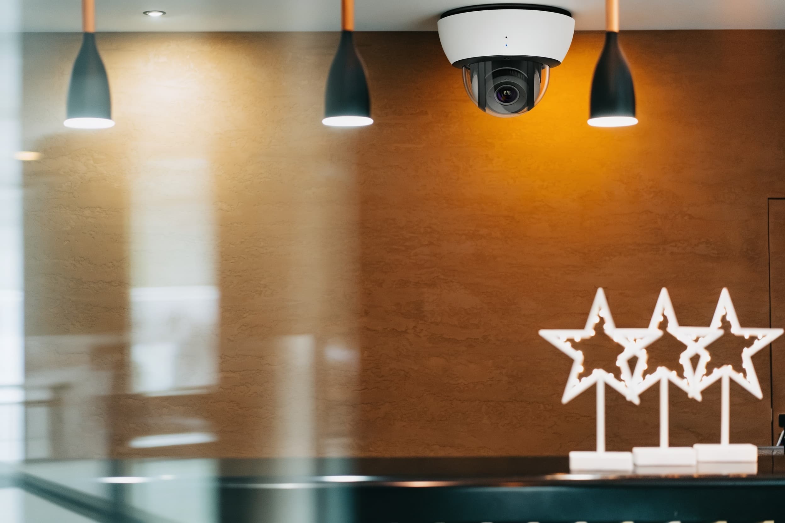 Ceiling-mounted security camera overlooking a hotel reception